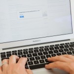 Person typing on a laptop