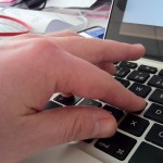 Hand showing a keyboard shortcut