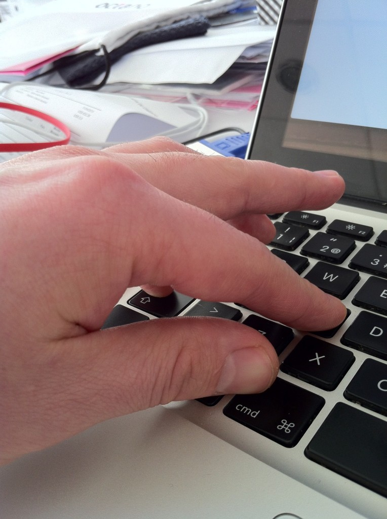 Hand showing a keyboard shortcut