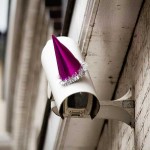 Surveillance camera with purple party hat