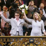 Kris Perry and Sandy Stier wave to the crowd