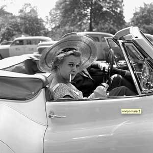 Photograph of stylish woman in car