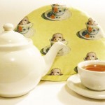 Teapot, tea cozy and teacup