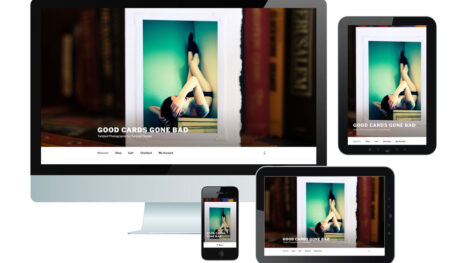 "Good Cards Gone Bad" web pages presented in different formats: desktop, vertical and horizontal tablet and mobile. Photo on screens: closeup of dark shelf with books; in foreground, cream-colored greeting card with image attached with white photo corners. Image: a white woman with dark hair, lying on her back on a dresser with her legs up the wall in a corner. The background of the image shades from light yellow to dark turquoise.