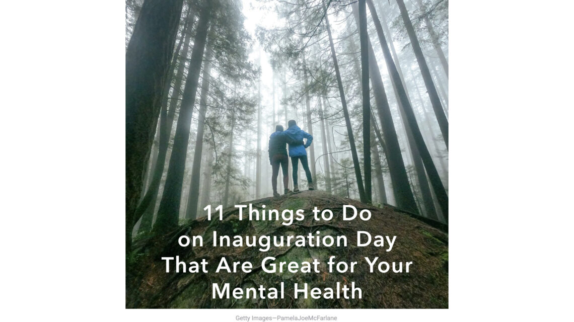 Misty forest scene with two people seen from the back, arms around each other, in the middle foreground. Across the bottom third is white type: "11 Things to Do on Inauguration Day That Are Great for Your Mental Health"