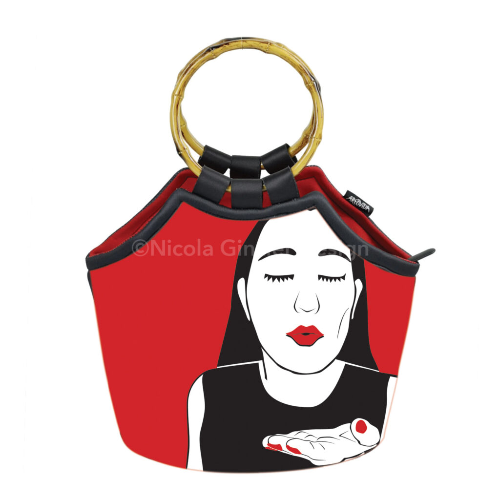 Bag with bamboo handles against white background with woman image. Cut paper-style digital illustration in black, red and white of a woman from the chest up, blowing a kiss at the viewer.