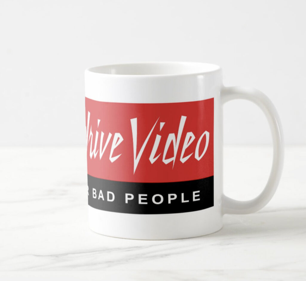 White ceramic mug with Max Overdrive Video logo, right view, on a marble counter. 