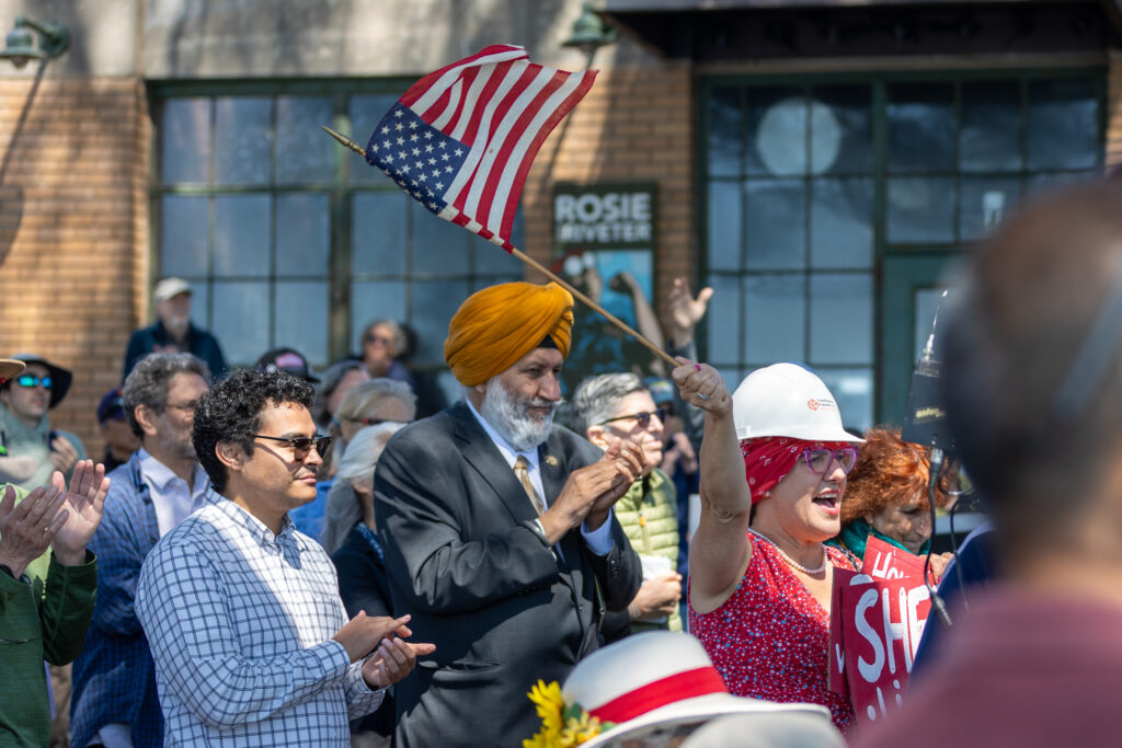 Photo of applauding crowd at National Park Service/Rosie the Riveter annibersary celebration