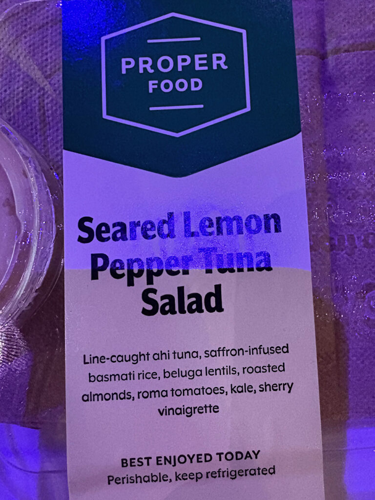 Food package under blue light - "Seared Lemon Pepper Tuna Salad"