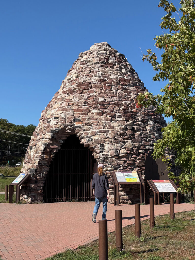 Beehive-shaped stone structure on brick plaza