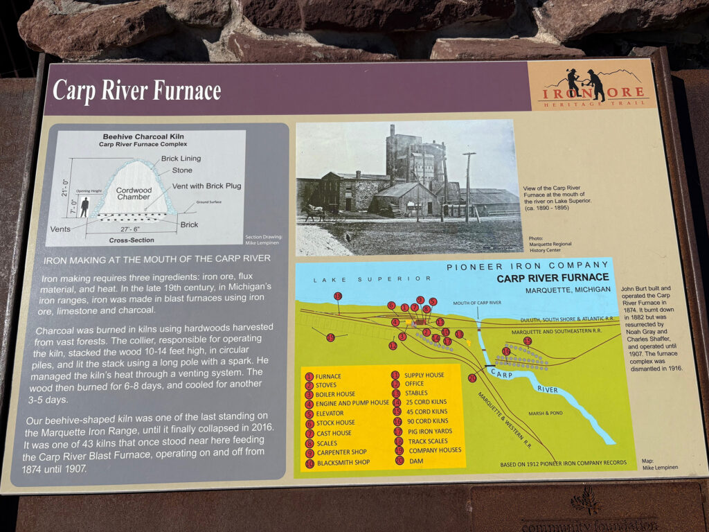 Large plaque with information about the beehive-shaped structure: Carp River charcoal Furnace