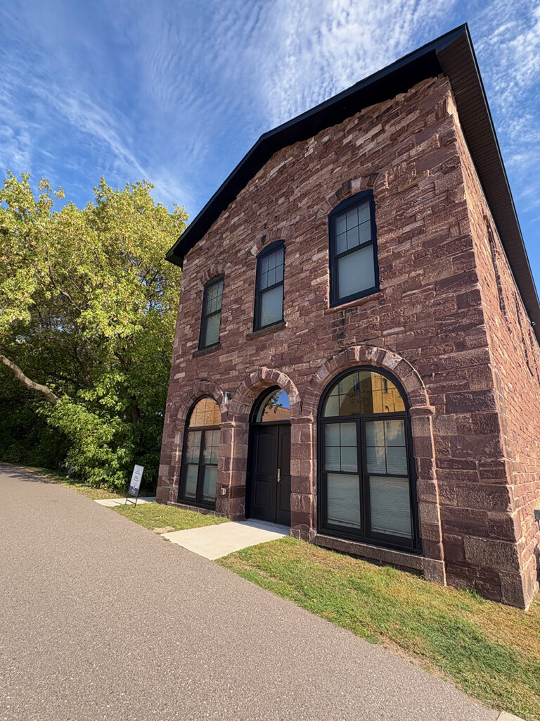 Perspective view of building built of red stone