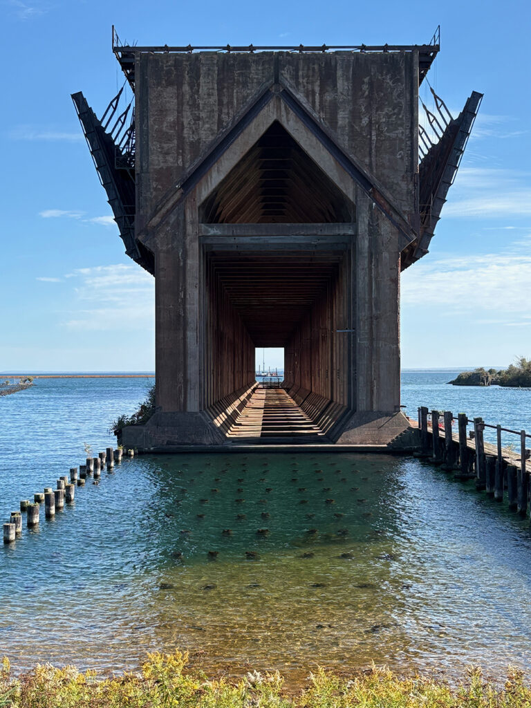 Perspective view of a huge concrete structure in blue water