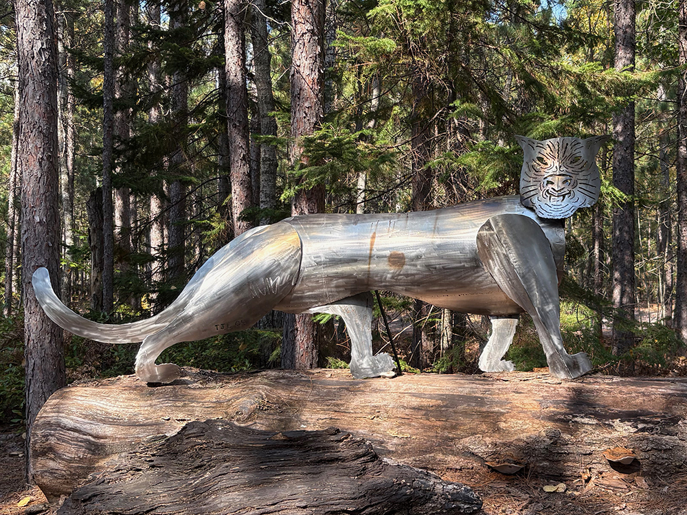 Large stainless steel sculpture of an abstract tiger