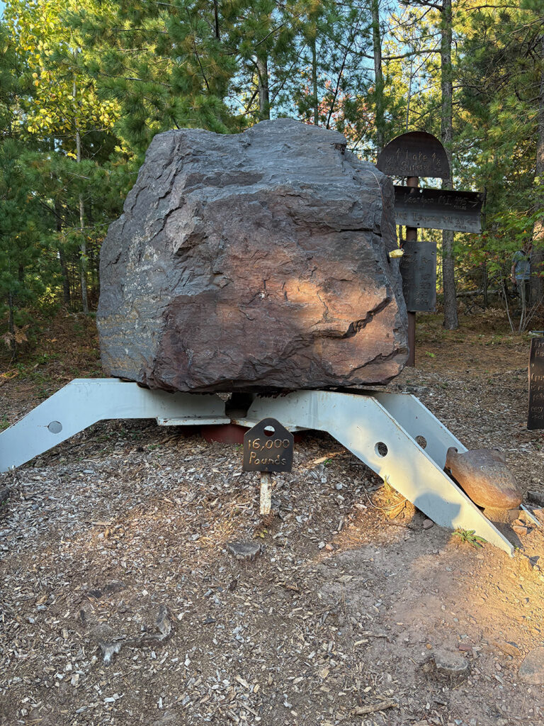 Large boulder resting on Steel supports