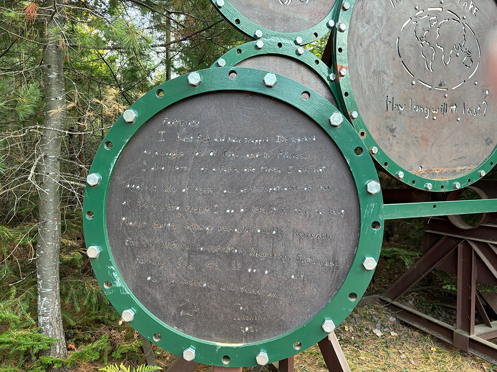 Closeup of metal circle with small indecipherable type.