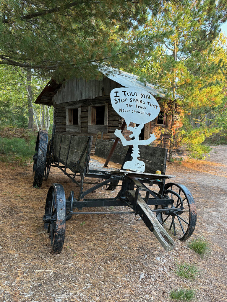 Dilapidated wagon with little creature saying "I told you to to stop saying that the truck never showed up"