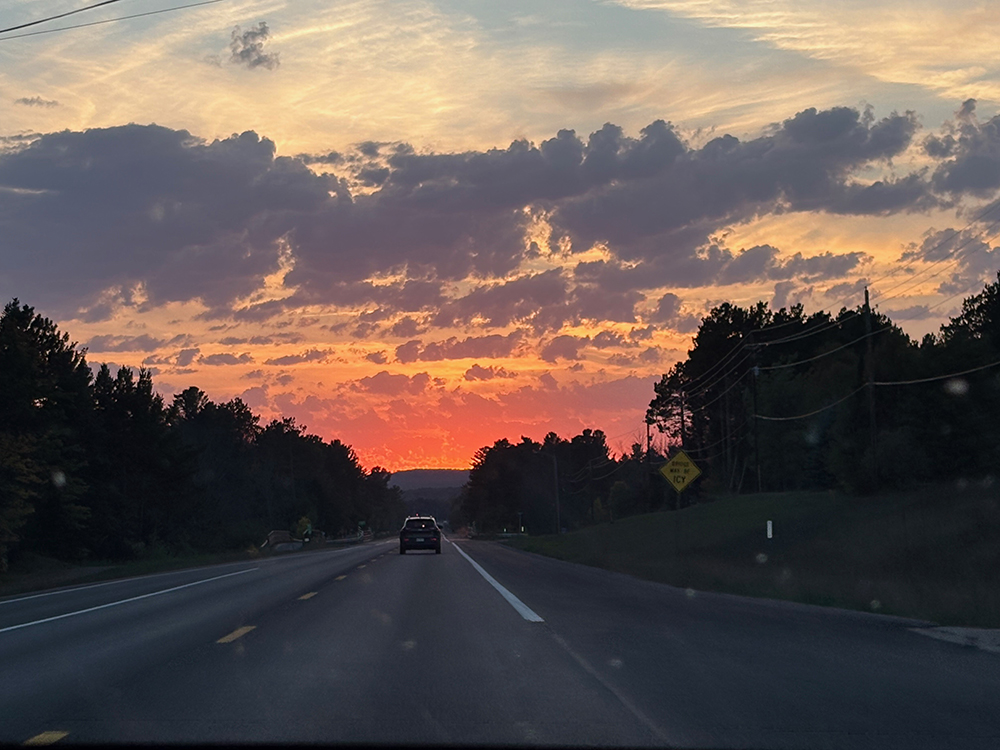 Colorful sunset over road