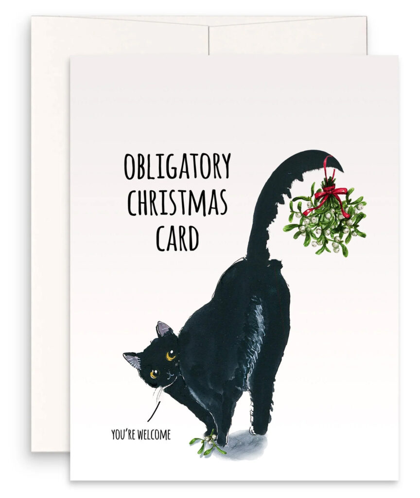 Photo of a greeting card with an illustration of a black cat with its body facing away from the viewer but its head turned back to look directly at the viewer. The cat has its rump in the air, with a sprig of mistletoe hanging from its tail. In the lower left corner is small black text that says "You're Welcome." In the upper left corner is large black type that says "Obligatory Christmas Card." Behind the card is the back of a white envelope.