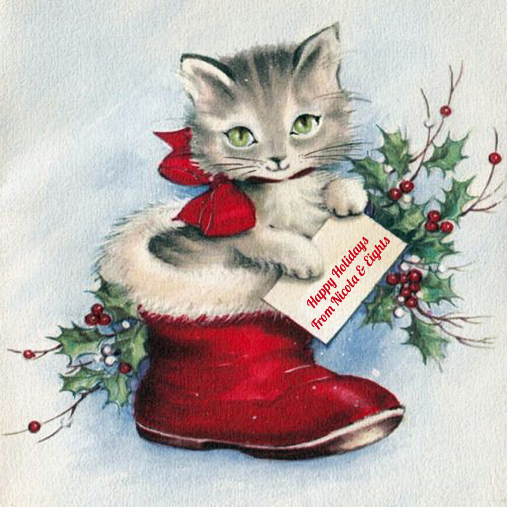 Square vintage-style illustration of a gray tabby kitten, sitting in a red Santa boot. Behind the kitten is holiday greenery. The kitten has a smiling mouth and light green eyes, and is holding a card that says "Happy Holidays from Nicola & Eights"